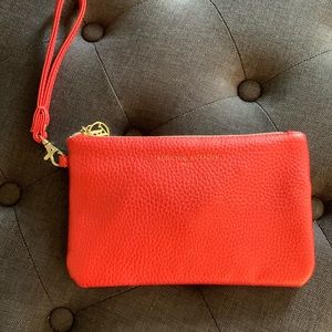 Adrienne Vittadini Studio Charging Wallet Wristlet in a bright tomato red